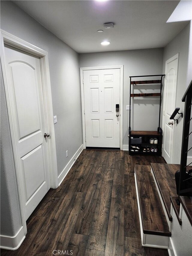 interior space with dark hardwood / wood-style flooring