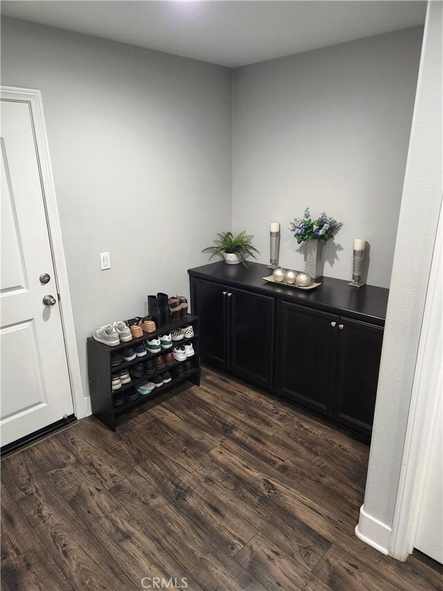 office with dark hardwood / wood-style flooring