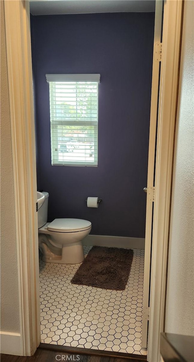 bathroom featuring tile patterned floors and toilet