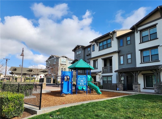 view of playground with a lawn