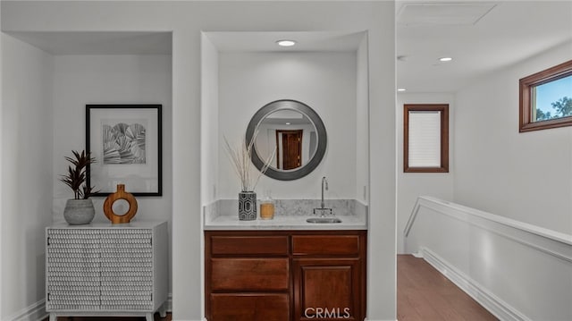 bathroom with vanity and hardwood / wood-style floors