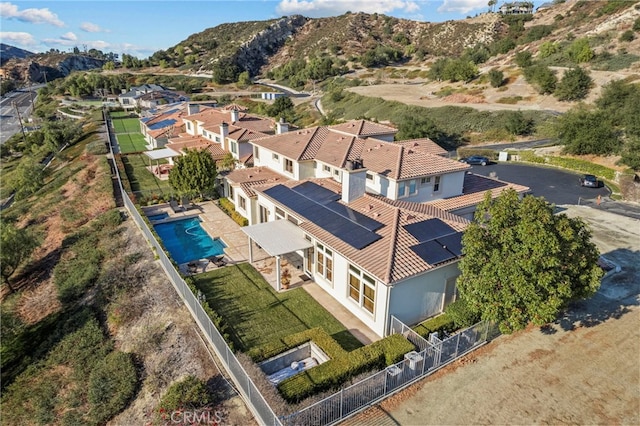 birds eye view of property featuring a mountain view