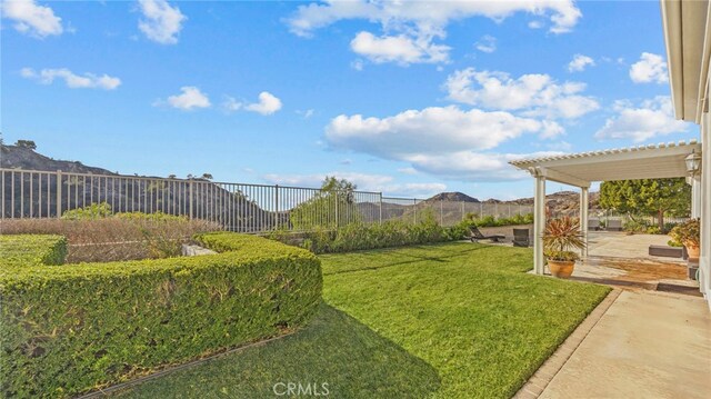 view of yard with a patio area and a pergola