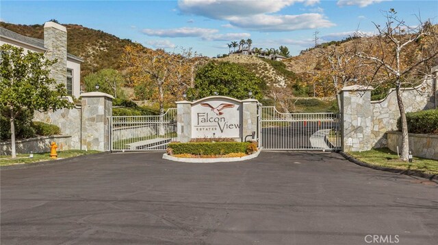 view of gate featuring a mountain view