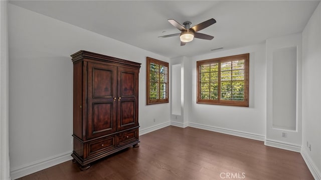 bedroom with dark wood-type flooring and ceiling fan