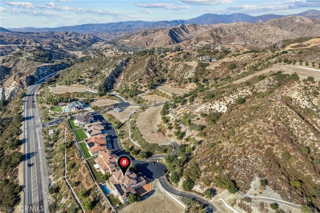 drone / aerial view featuring a mountain view