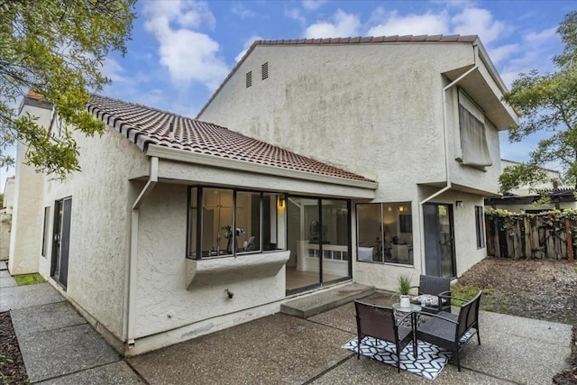 rear view of property with a patio