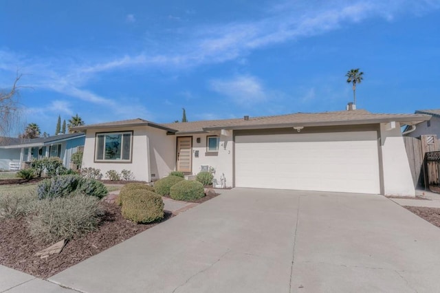 ranch-style home featuring a garage