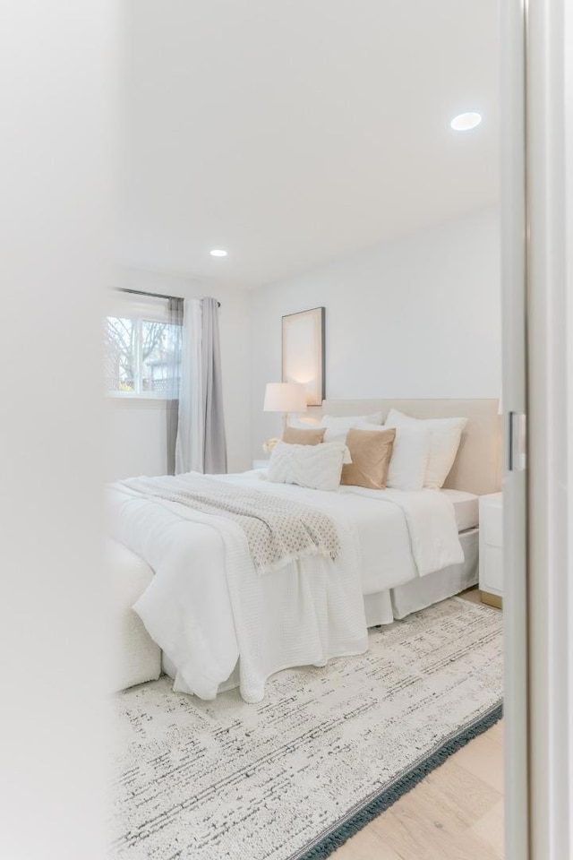 bedroom with wood-type flooring