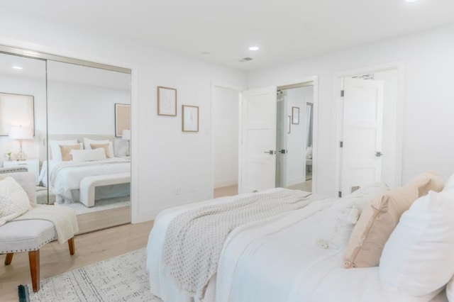 bedroom with light wood-type flooring