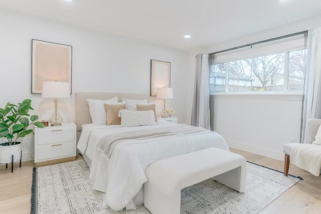 bedroom with light hardwood / wood-style floors