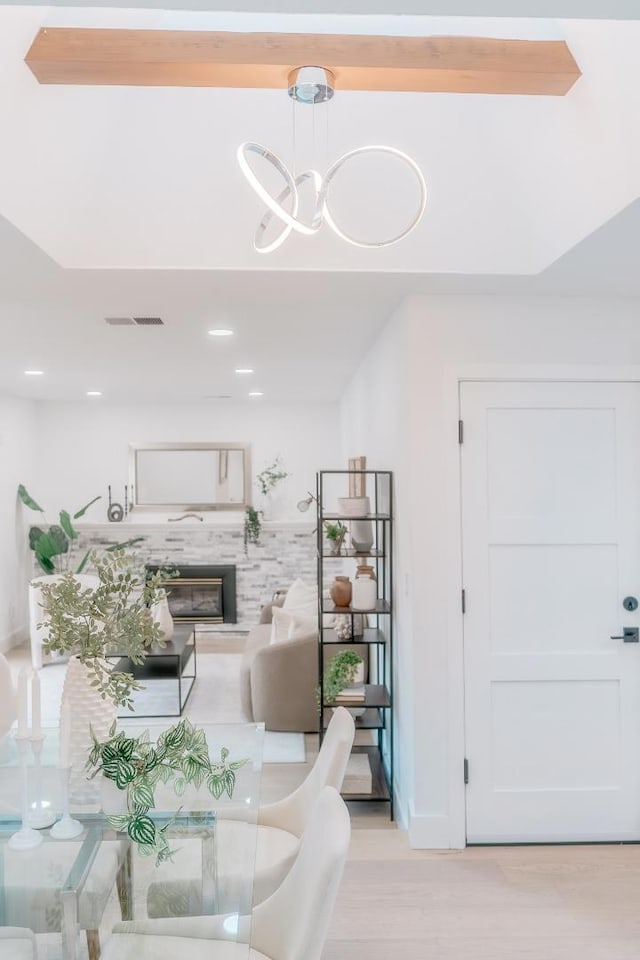 dining area with an inviting chandelier and light hardwood / wood-style floors