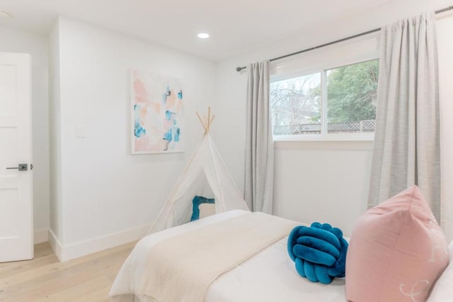 bedroom with light wood-type flooring