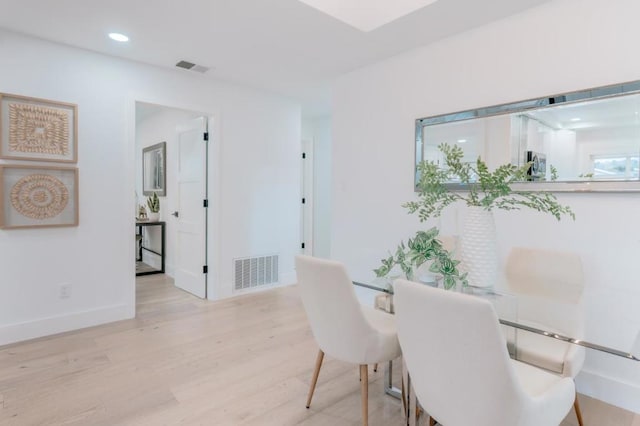 dining space featuring light hardwood / wood-style flooring