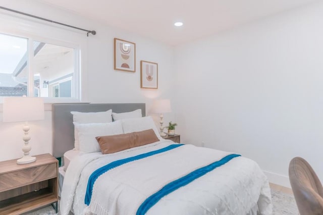 bedroom with wood-type flooring