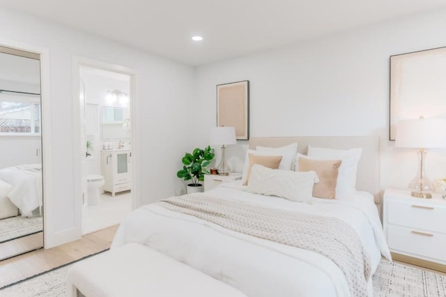 bedroom with light hardwood / wood-style floors