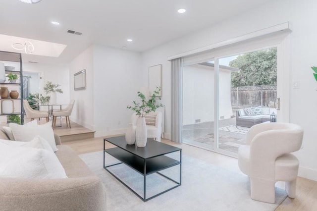 living room with light hardwood / wood-style flooring