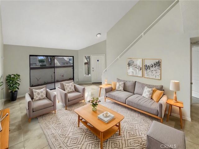 tiled living room with lofted ceiling