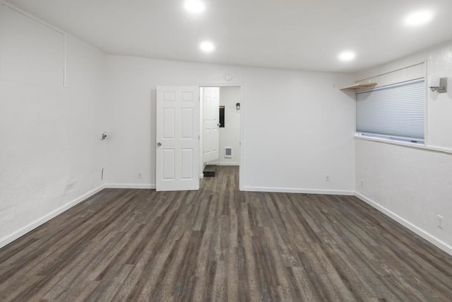 unfurnished room featuring dark hardwood / wood-style floors