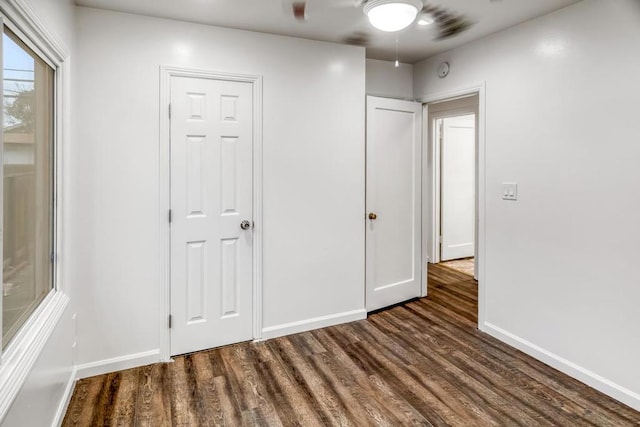 unfurnished bedroom featuring dark hardwood / wood-style flooring