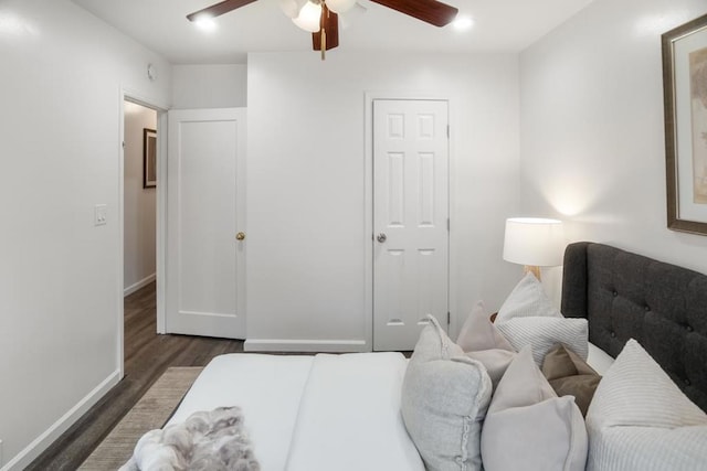 bedroom with dark wood-type flooring and ceiling fan