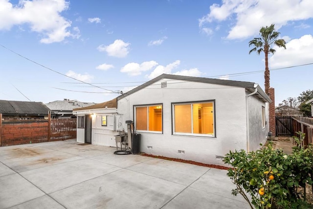 rear view of house with a patio