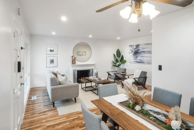 dining area featuring ceiling fan and light hardwood / wood-style flooring