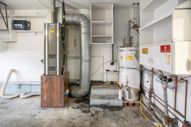 utility room featuring water heater