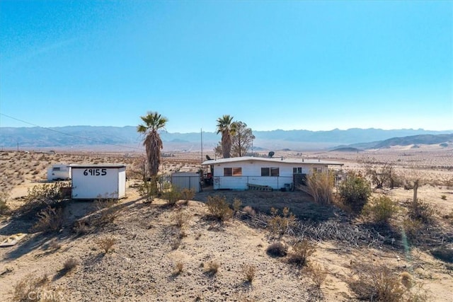 single story home with a mountain view and a rural view