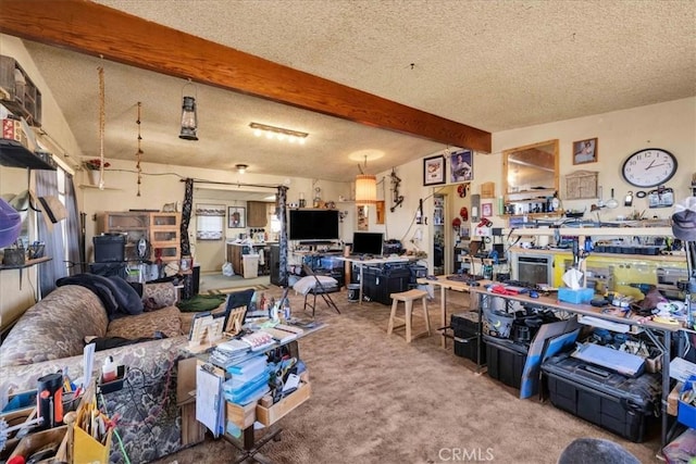 interior space with beam ceiling, a workshop area, and a textured ceiling