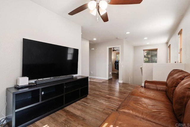 living area with baseboards, dark wood finished floors, a ceiling fan, and recessed lighting