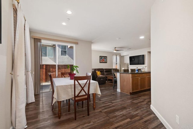 dining room featuring baseboards, dark wood-style flooring, and recessed lighting