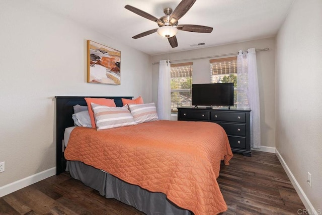 bedroom with dark wood-type flooring, visible vents, and baseboards