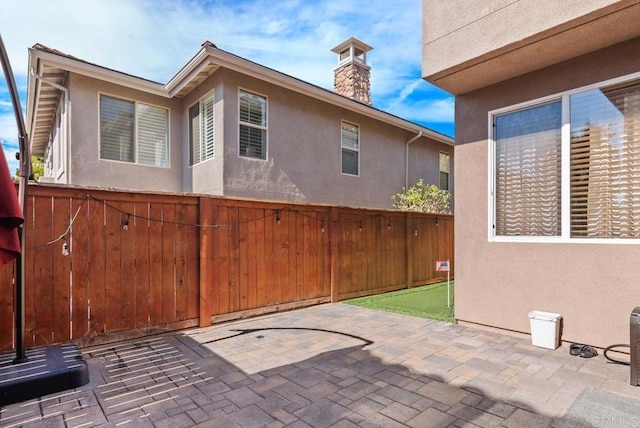 view of patio featuring fence