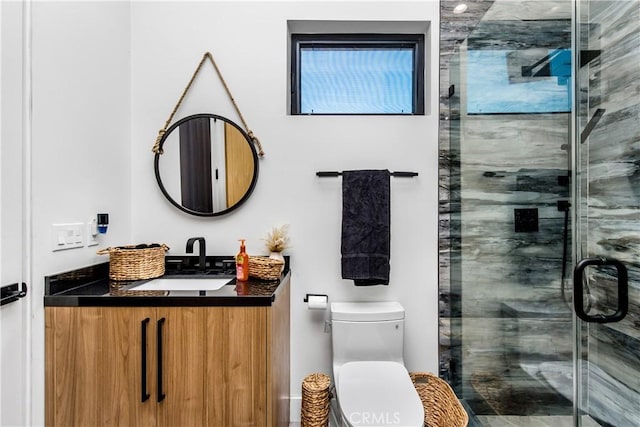 bathroom with vanity, toilet, and walk in shower