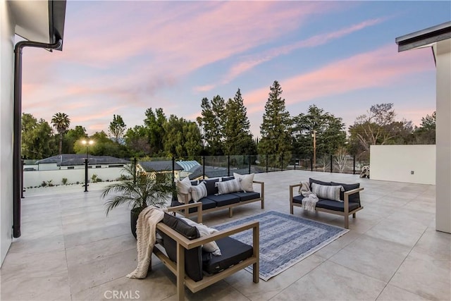 patio terrace at dusk with an outdoor living space