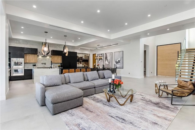 living room featuring a raised ceiling