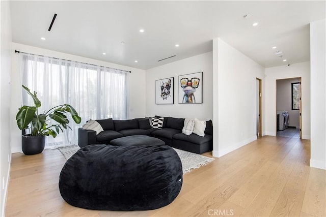 living room with light hardwood / wood-style floors