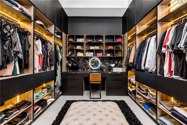 walk in closet featuring built in desk