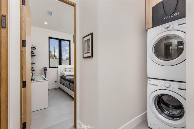 laundry room featuring stacked washing maching and dryer