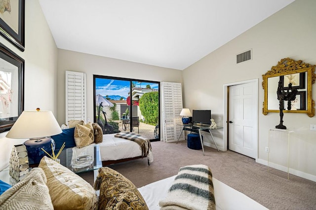 living room with carpet flooring and high vaulted ceiling