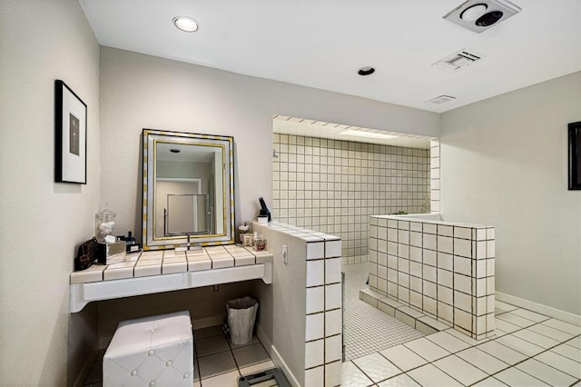 bathroom with walk in shower and tile patterned floors