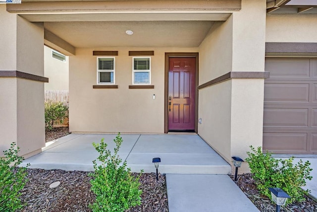 property entrance with a garage