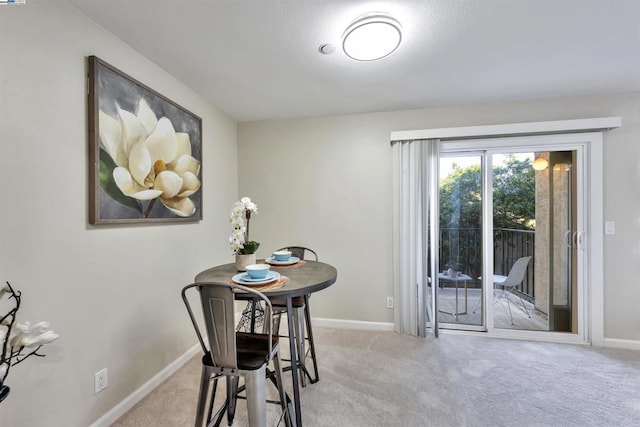 view of carpeted dining area