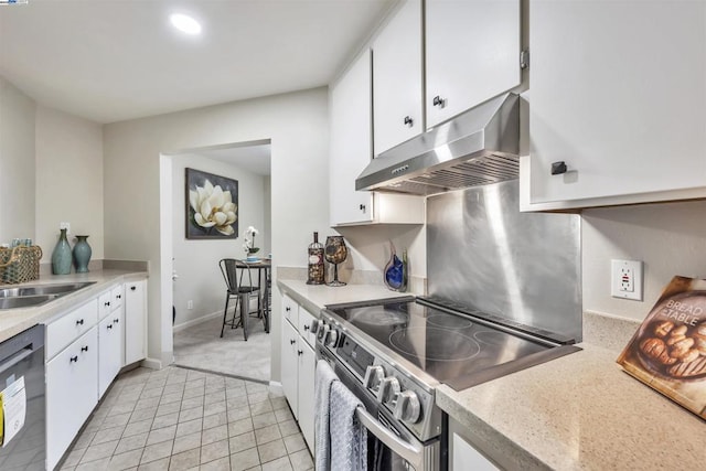 kitchen featuring dishwasher, ventilation hood, stainless steel range with electric cooktop, and white cabinets