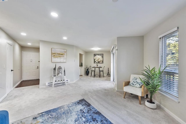 sitting room with carpet floors and a baseboard radiator