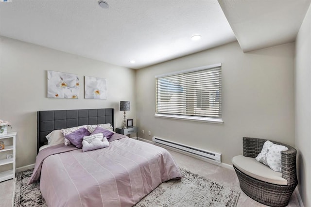 bedroom with light colored carpet and baseboard heating