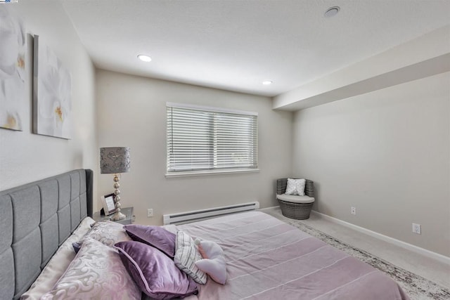 carpeted bedroom featuring a baseboard radiator