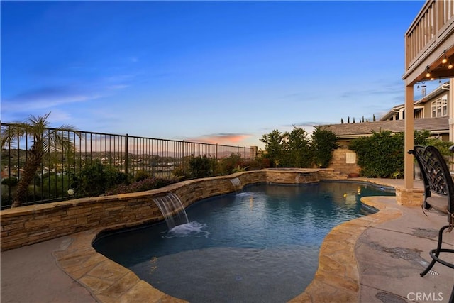 view of swimming pool with a patio area, a fenced backyard, and a pool with connected hot tub