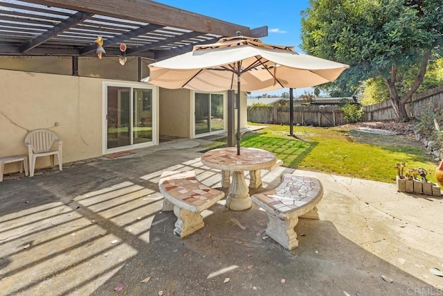 view of patio / terrace featuring fence and a pergola